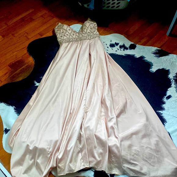 Champagne colored ball gown with leg slit and corset back